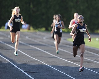 CANFIELD, OHIO - MAY 13, 2014: Nautica Hill of Harding sprints to the finish line ahead of the pack during the girls 400 meter dash during the AAC Red Tier Division track meet at Canfield High School. (Photo by David Dermer/Youngstown Vindicator) ..Emily Stevens WGH, Jena Johnson East, Kristina Hallof Canfield pictured.