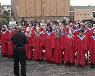        ROBERT K. YOSAY  | THE VINDICATOR..Austintown Fitch High School Choir sang at the service..YSU - "the Reading of the Name" an annual service to honor the YSU students and faculty that lost their lives in service to the country was combined this year with the The American Veterans Traveling Tribute/Vietnam Traveling Wall -Wednesday through Sunday...The 360-foot-long wall, an 80-percent scale version of the Vietnam Memorial Wall in Washington, D.C., will be open for viewing round-the-clock in the parking lot on Wood Street at YSU..-..                    -30-