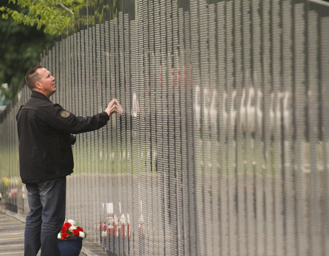        ROBERT K. YOSAY  | THE VINDICATOR.. Austintown ex Marine James Skok... at the wall..YSU - "the Reading of the Name" an annual service to honor the YSU students and faculty that lost their lives in service to the country was combined this year with the The American Veterans Traveling Tribute/Vietnam Traveling Wall -Wednesday through Sunday...The 360-foot-long wall, an 80-percent scale version of the Vietnam Memorial Wall in Washington, D.C., will be open for viewing round-the-clock in the parking lot on Wood Street at YSU..-..                    -30-