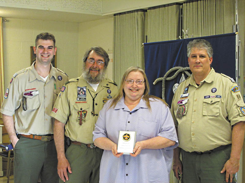 SPECIAL TO THE VINDICATOR 
The Harnishfeger family of Boardman was named the 2013 Scouting Family of the Year at a Scouting awards event in April. From left are Preston Cockrell, presenter, Byron and Beth Harnishfeger and District Chairman Kurt Hilderbrand. Karl Harnishfeger also is part of the family.