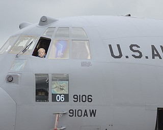 Katie Rickman | The Vindicator.Mitchel Horkie (OKAY), 3, of Austintown climbs up into a C130 and looks out the window at Thunder Over the Valley May 17, 2014.