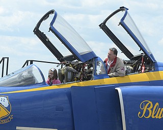 Katie Rickman | The Vindicator.Carl Juergens looks forward at his grand daughter Jada Stanford, 7, in a Blue Angel jet at Thunder Over the Valley May 18, 2014. (both of Hartford)