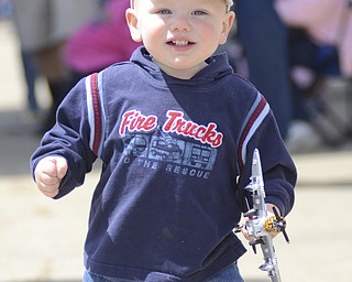 Katie Rickman | The Vindicator.Logan Gramsky, 1 yr old of Brookfield, plays with his miniature plane during Thunder Over the Valley May 18, 2014.