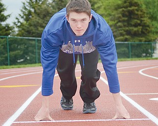 Poland’s Aaron King, 18, warms up before a track meet last Friday at Hubbard High School. King has healed
from tearing an ACL during a football game last fall.
