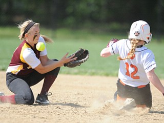NORTH LIMA, OHIO - MAY 19, 2014: Infielder Stevie Taylor #8 bobbles the ball while trying to tag out a sliding Rhonda Rothacker #12 of Newton Falls as she steals second base in the top of the 3rd inning during a game at South Range High School. (Photo by David Dermer/ Youngstown Vindicator)