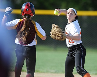 NORTH LIMA, OHIO - MAY 19, 2014: Infielder Hallie Stamm #25 of Newton Falls looks to first base before the throw after steping on second base to force out base runner Caragyn Yanek #7 of South Range during a game at South Range High School. (Photo by David Dermer/ Youngstown Vindicator)
