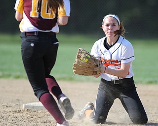NORTH LIMA, OHIO - MAY 19, 2014: Infielder Hallie Stamm #25 of Newton Falls prepares to tag out base runner Lydia Baird #10 of South Range during a game at South Range High School. (Photo by David Dermer/ Youngstown Vindicator)