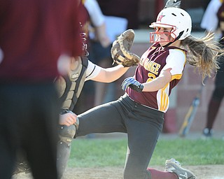 NORTH LIMA, OHIO - MAY 19, 2014: Base runner Jessica Skirpak #2 of South Range slides into home plate to score the game winning run in the bottom of the 9th inning during a game at South Range High School. (Photo by David Dermer/ Youngstown Vindicator)