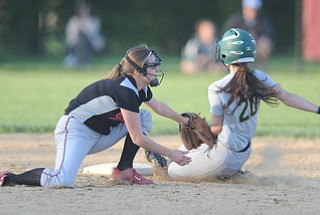 NORTH LIMA, OHIO - MAY 19, 2014: Base runner Anny Carroll #20 of Ursuline is tagged out trying to steal second base by infielder Mel Bakes #4 of Girard during a game at South Range High School. (Photo by David Dermer/ Youngstown Vindicator)