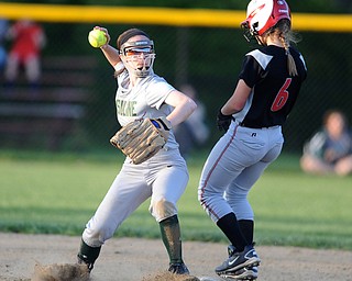 NORTH LIMA, OHIO - MAY 19, 2014: Infielder Anny Carroll #20 of Ursuline throws the ball to first after stepping on second base to force out base runner Annie Parillo #6 of Girard during a game at South Range High School. (Photo by David Dermer/ Youngstown Vindicator)