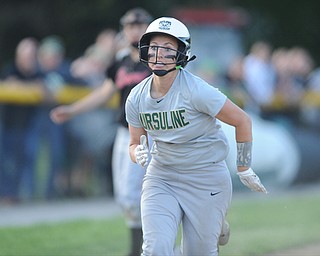 NORTH LIMA, OHIO - MAY 19, 2014: Base runner Stephanie Ohalek #9 of Ursuline sprints home to score the 3rd Ursuline run of the game after the throw went into the dead ball zone after a throw to third base during a game at South Range High School. (Photo by David Dermer/ Youngstown Vindicator)