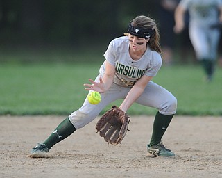 NORTH LIMA, OHIO - MAY 19, 2014: Infielder McKenzie Stimpert #33 of Ursuline fields the ball before throwing it to first for the third out in the top of the 7th inning during a game at South Range High School. (Photo by David Dermer/ Youngstown Vindicator)