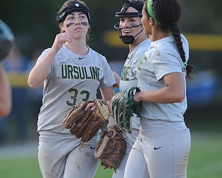 NORTH LIMA, OHIO - MAY 19, 2014: InfieldersMcKenzie Stimpert #33, Macey Gunther #7 and pitcher MaKayla Shore #00 of Ursuline celebrate after the final out of the game during a game at South Range High School. (Photo by David Dermer/ Youngstown Vindicator)