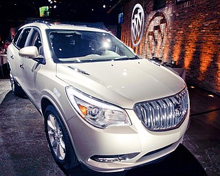The 2013 Buick Enclave is unveiled at a news conference ahead of the New York International Car Show in New York. General Motors announced Tuesday the recall of 2.4 million vehicles in the U.S., including the 2013 Enclave and other full-size crossovers from the 2009-2014 model-years.
