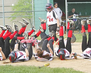 William D Leis The Vindictor Canfield'sRachel Tinkey(24) scores homer as her team mates do their home run drill during Thursday game with Lakeview.