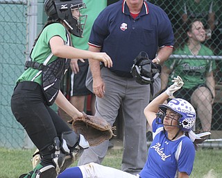 Poland'sBrielle Nocera(4) scores as WB catcherBailey Byers(2) waits for the throw during Thursday action in Alliance.