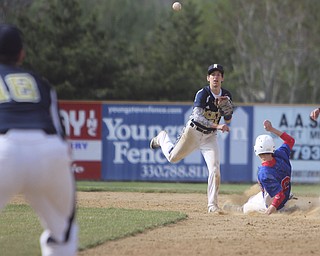 Lowellville's Spiro Schaldone (25) turns a double play after getting the force out on Western Reserve's Dan Zilke (6) during Thursday afternoons matchup at Bob Cene Park in Struthers. Dustin Livesay  |  The Vindicator  5/22/14  Bob Cene Park.