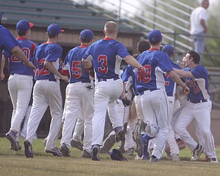The Western Reserve baseball team clears the dugout to celebrate on the third baseline with Dan Zilke after he hit the game winning triple to beat Lowellville 3-2 in the bottom of the seventh inning.  Dustin Livesay  |  The Vindicator  5/22/14  Bob Cene Park.