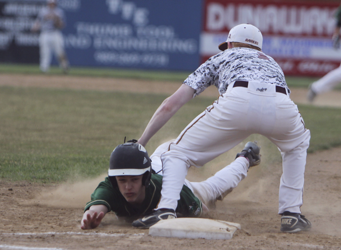 South Range's Josh Fromel (1,right) tags out Ursuline's Gianni Quattro (12) at first base  during Thursday evenings matchup at Bob Cene Park in Struthers.  Dustin Livesay  |  The Vindicator  5/22/14  Struthers.