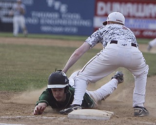 South Range's Josh Fromel (1,right) tags out Ursuline's Gianni Quattro (12) at first base  during Thursday evenings matchup at Bob Cene Park in Struthers.  Dustin Livesay  |  The Vindicator  5/22/14  Struthers.