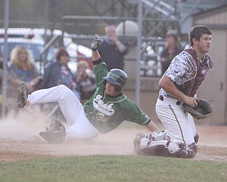 Ursuline's Logan Pullin (34) slides in safly at home behind South Range catcher Ryan Miller (19) during Thursday evenings matchup at Bob Cene Park in Struthers.  Dustin Livesay  |  The Vindicator  5/22/14  Struthers.