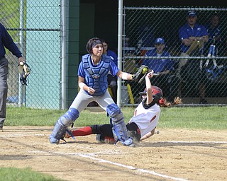 Poland's Jenna Schettler (5) tags Canfield's Maura Kennedy out during the first inning of the Division II District Championship game at Alliance High School May 23, 2014. Poland won 7-6 in the 8th inning.