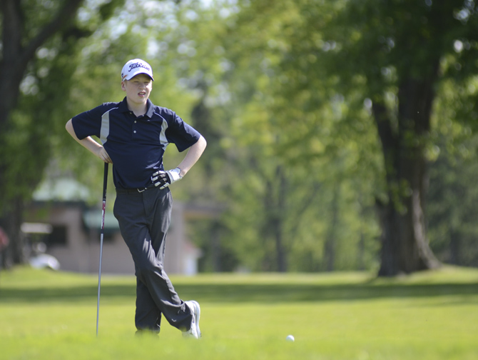 Katie Rickman | The Vindicator.Conner Stevens, 12, of Brookfield waits his turn during the Greatest Golfer Junior Qualifier May 24, 2014.
