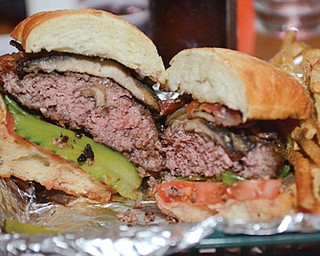 The char-grilled burgers at The Vista Lounge on Donald Avenue boast a half-pound of Angus beef.