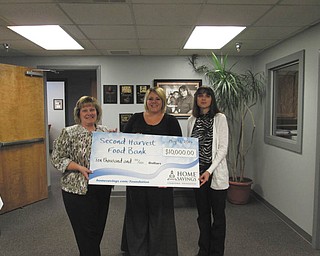 SPECIAL TO THE VINDICATOR
Home Savings Charitable Foundation recently donated $10,000 to Second Harvest Food Bank of the Mahoning Valley. Second Harvest will use the funds for construction of a truck shelter to increase safety of the employees and drivers. From left are Kim Gennaro, branch manager of Home Savings Liberty office; Miriam Klein, grant officer of Second Harvest; and Jeannette Montgomery, retail manager of Home Savings Liberty office. For information about Second Harvest call 330-792-5522 or visit www.mahoningvalleysecondharvest.org.