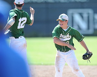 MASSILLON, OHIO - MAY 29, 2014: Infielders Gianni Quattro #12 and Joel Hake #8 of Ursuline celebrate after the game ending double play turned by Hake during a OHSAA tournament game at Massillon Washington High School. Ursuline won 7-5. (Photo by David Dermer/Youngstown Vindicator)
