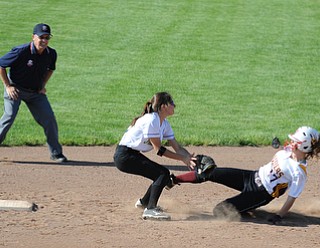 MASSILLON, OHIO - MAY 29, 2014: Base runner Jordan Youngs #17 of South Range is tagged out by infielder Katie George #27 of Independence to end the 4th inning during a OHSAA tournament game at Massillon Washington High School. Independence won 3-0. (Photo by David Dermer/Youngstown Vindicator)