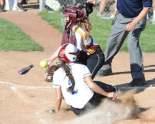 MASSILLON, OHIO - MAY 29, 2014: Base runner Abbi Tarski #2 of Independence slides into home plate to avoid catcher Sarah Moretti #11 of South Range after she misplayed the ball during a OHSAA tournament game at Massillon Washington High School. Independence won 3-0. (Photo by David Dermer/Youngstown Vindicator)