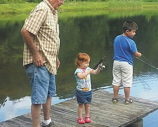 Great-grandpa Hart teaching the kids to fish. Sent by Debbie.