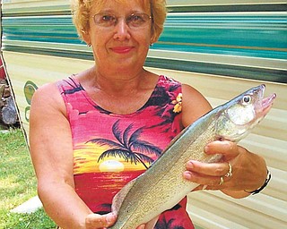 This is a "selfie" of me, Annette, that I took a few years ago at Lake Side Campgrounds in Berlin Center. I caught this nice walleye from Berlin Lake.