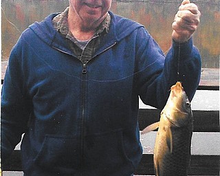 Dom Monroe of Boardman submitted this photo of his best friend, Jack Drummond of Austintown, who caught a carp at Lake Newport in October, 2013.