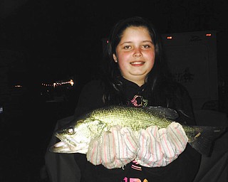 My daughter Kasena Thompson with her first bass of the season caught at Green Acres Lake Park Campground in Lake Milton. Sent by her dad, Ricky Thompson.