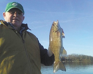 This is Terry Himes of North Jackson catching a small mouth bass at Lake Milton. The photo was taken by Jack Dill of Campbell.