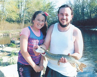 Nevaeha Carkido of McDonald with her father, Adam Hvisdak, fishing at Mosquito Lake on Mother's Day. Nevaeha caught the 25-inch blue pike with other fishers rooting her on. This was her best catch since she started fishing with her dad. They threw him back to grow bigger for next time. Sent by grandma, Deb McCalpin.