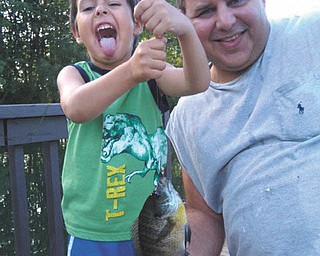 This is proud Alex with his proud Ohio bluegill ... his first cast, too. Needless to say he was thrilled. Sent by Rich Berg