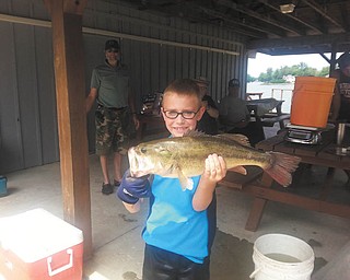 Attached is a picture of my son, Ryan Lamb, 9, of Canfield, with his prize-winning bass caught while trolling with his Papa, Dave Emick (not pictured) at Roaming Shores, Ohio. Ryan won $25 for the longest bass in this fishing contest. Photo submitted by Ryan's mom, DeAnne Edwards-Lamb.