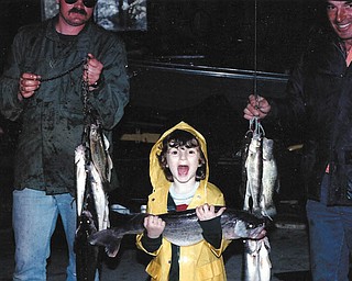 Five-year old Beth holds the 28-inch, 7 pound fish that her dad, Mike Fox, and grandpa, Loren Burns, caught on Mother’s Day in 1984.