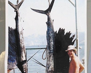 HereÕs a snapshot of Ed Lewis Jr. from Campbell with his two sailfish, caught while on a fishing trip vacation in Acapulco, Mexico. They weighed 130 and 115 pounds respectively. Sent by John Frohman of Hubbard.
