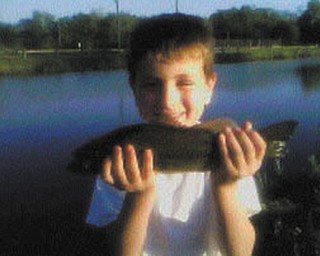 Andrew Prvonozac from Warren, is all smiles with his catch!. Sent by George Prvonozac, his dad.