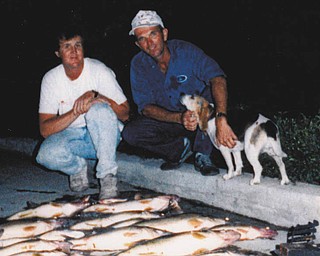 Leonard Sopik of Niles, on the right, and Dale Slezyak of Girard in 1990 on Lake Erie drifting out of Conneaut. Len always took me, the Òpain in the butt kid.Ó