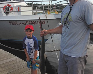 Andy Ward, 6, caught this shark at Myrtle Beach in August 2013. He refused to hold it, so his dad, Ryan, showed it off for him! Sent by AndyÕs mom, Jen of Poland.