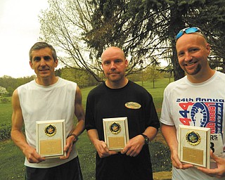 SPECIAL TO THE VINDICATOR
Overall winners in the Austintown Lions’ 5K Run are, left to right, Tom Grantonic, first place; Don Peace, second place; and Everett Briggs, third place.