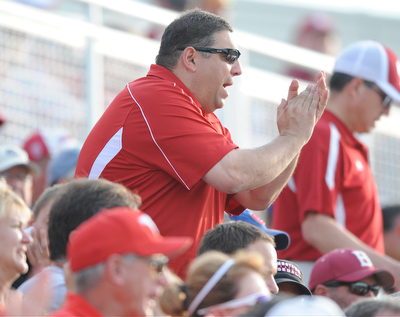 BLOOMINGTON, INDIANA - MAY 30, 2014: Fan Greg DiNello of Youngstown cheers from the stands after a Youngstown State out during Friday nights regional tournament game against Indiana University. (Photo by David Dermer/Youngstown Vindicator)