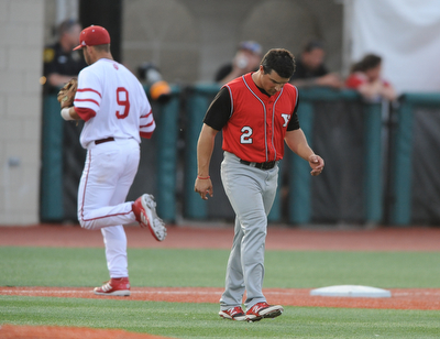 BLOOMINGTON, INDIANA - MAY 30, 2014: Base runner Mike Accardi #2 of Youngstown State hangs his head while walking across the infield after being stranded on third base and being unable to score a run during Friday nights regional tournament game against Indiana University. (Photo by David Dermer/Youngstown Vindicator) Indiana #9 Casey Rodrigue pictured.