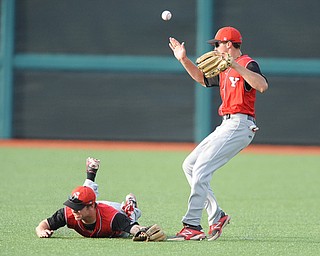 BLOOMINGTON, INDIANA - MAY 30, 2014: Outfielders Jonas Wellan #12 jumps while trying to play the ball and avoid a sliding Kevin Hix #1 of Youngstown State after a bloop Indiana hit during Friday nights regional tournament game against Indiana University. (Photo by David Dermer/Youngstown Vindicator)
