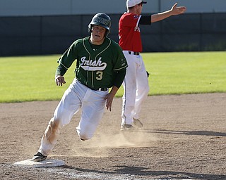In the 3rd inning, Ursuline's#3 Andrew Potesta rounds 3rd to score
